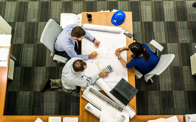 3 business people in meeting